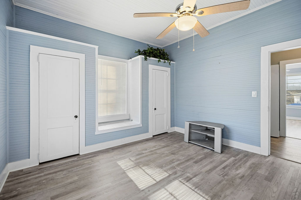 215 Louisiana Street Honea Path, SC 29654 - Photo 18 of 26 This bright room features durable flooring and a ceiling fan for comfort.