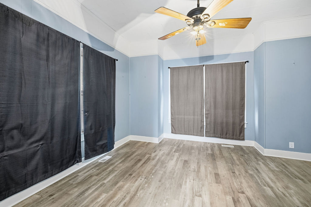 215 Louisiana Street Honea Path, SC 29654 - Photo 20 of 26 This airy room features durable flooring and ample natural light, perfect for any living arrangement.