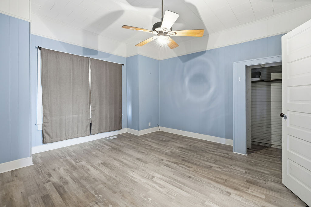 215 Louisiana Street Honea Path, SC 29654 - Photo 21 of 26 This airy room offers light-toned flooring and an open doorway.