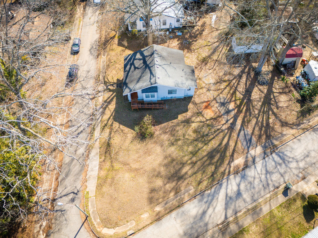 215 Louisiana Street Honea Path, SC 29654 - Photo 23 of 26 An aerial perspective reveals a cozy home nestled amidst a quiet neighborhood street.