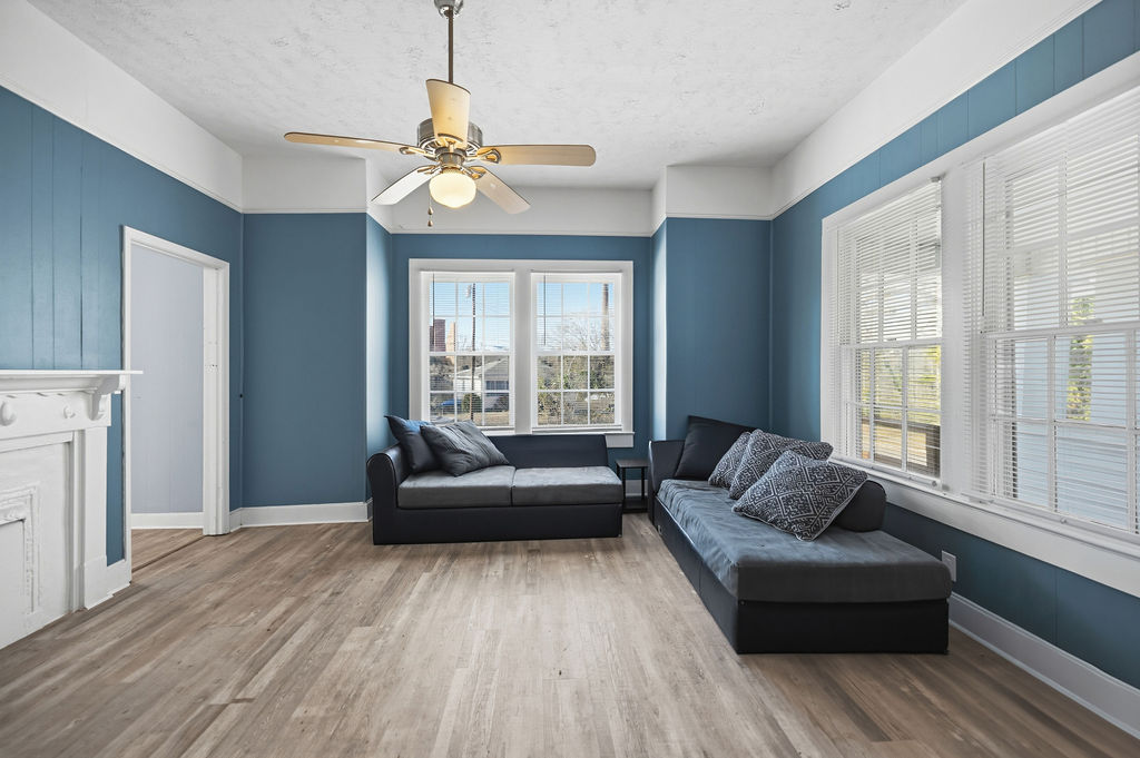 215 Louisiana Street Honea Path, SC 29654 - Photo 8 of 26 This airy living space offers ample natural light and a comforting atmosphere.