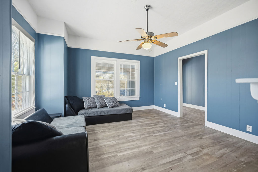 215 Louisiana Street Honea Path, SC 29654 - Photo 10 of 26 Bright and airy living room with ample natural light, creating a welcoming atmosphere.