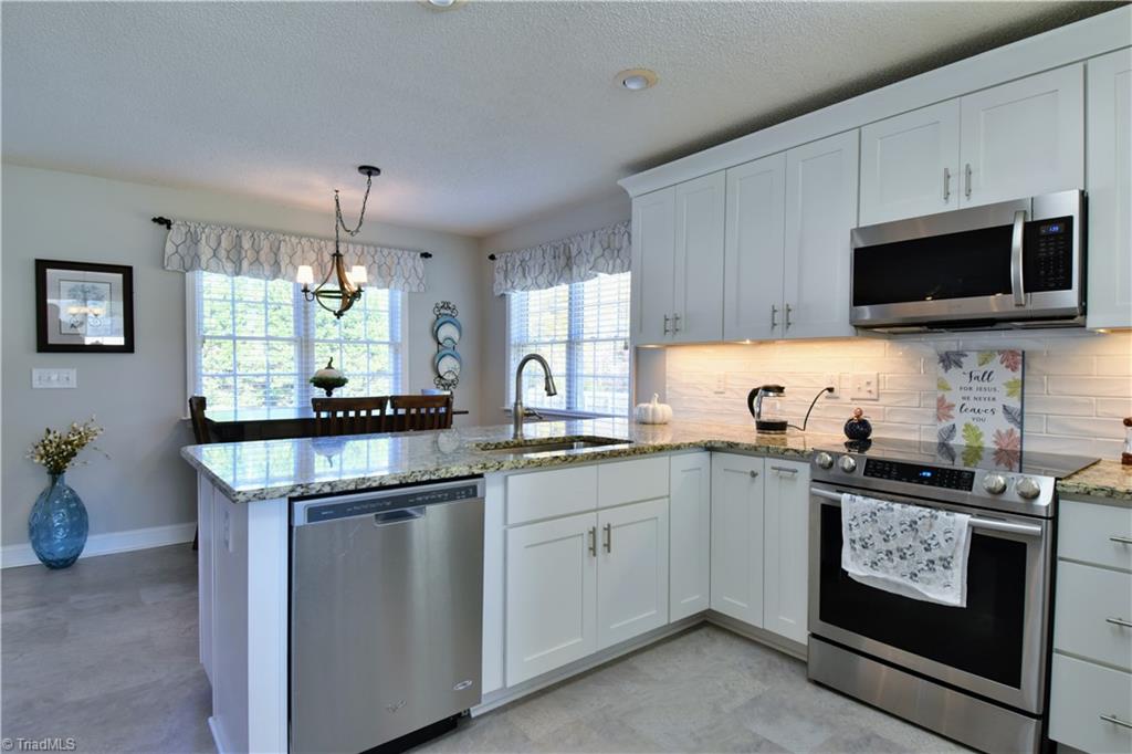 111 Montclair Drive Advance, NC 27006 - Photo 14 of 44 Kitchen was recent redone, new cabinetry, appliances, flooring, lights