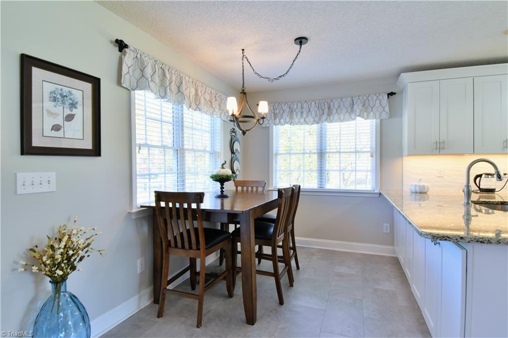 111 Montclair Drive Advance, NC 27006 - Photo 16 of 44 Breakfast area, note cabinets under bar area