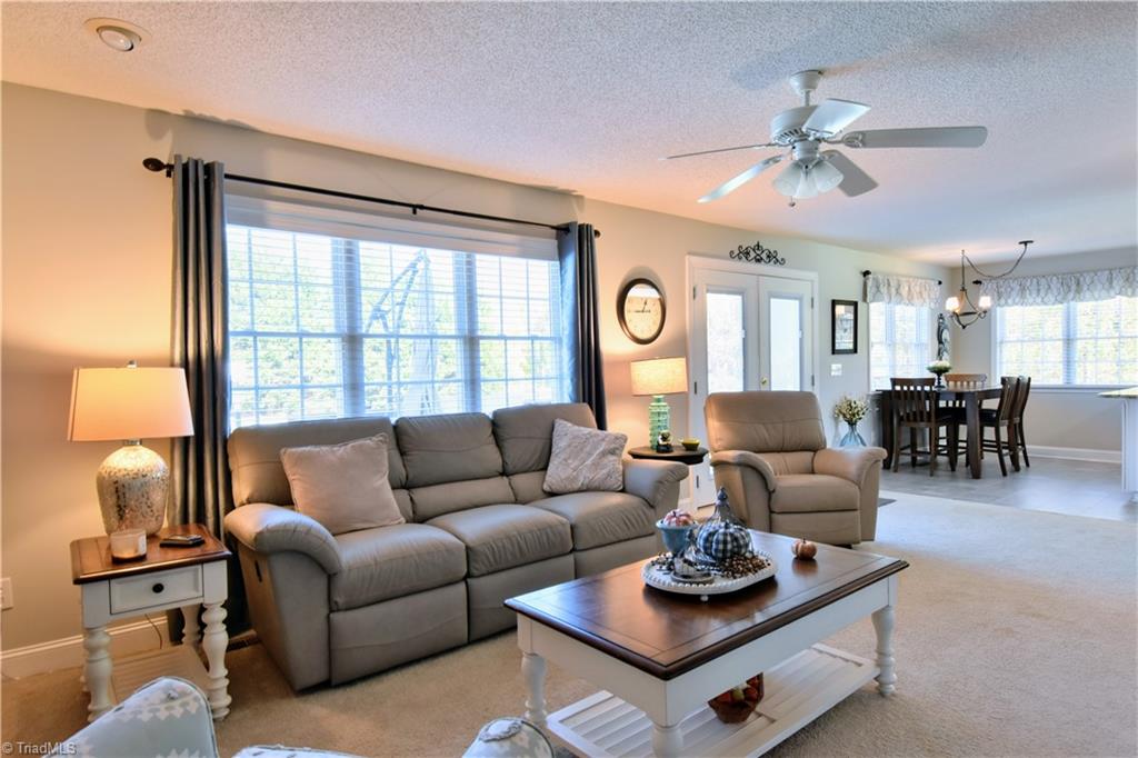 111 Montclair Drive Advance, NC 27006 - Photo 22 of 44 Den area, windows on back of house overlook pool area