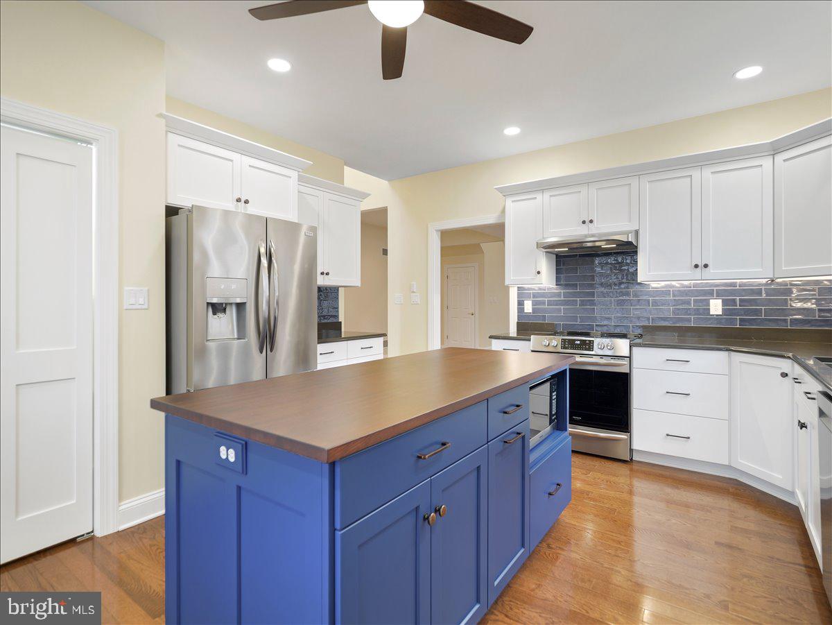 6881 Old Course Road Fayetteville, PA 17222 - Photo 12 of 40 a kitchen with stainless steel appliances granite countertop a refrigerator a sink dishwasher a stove and a refrigerator