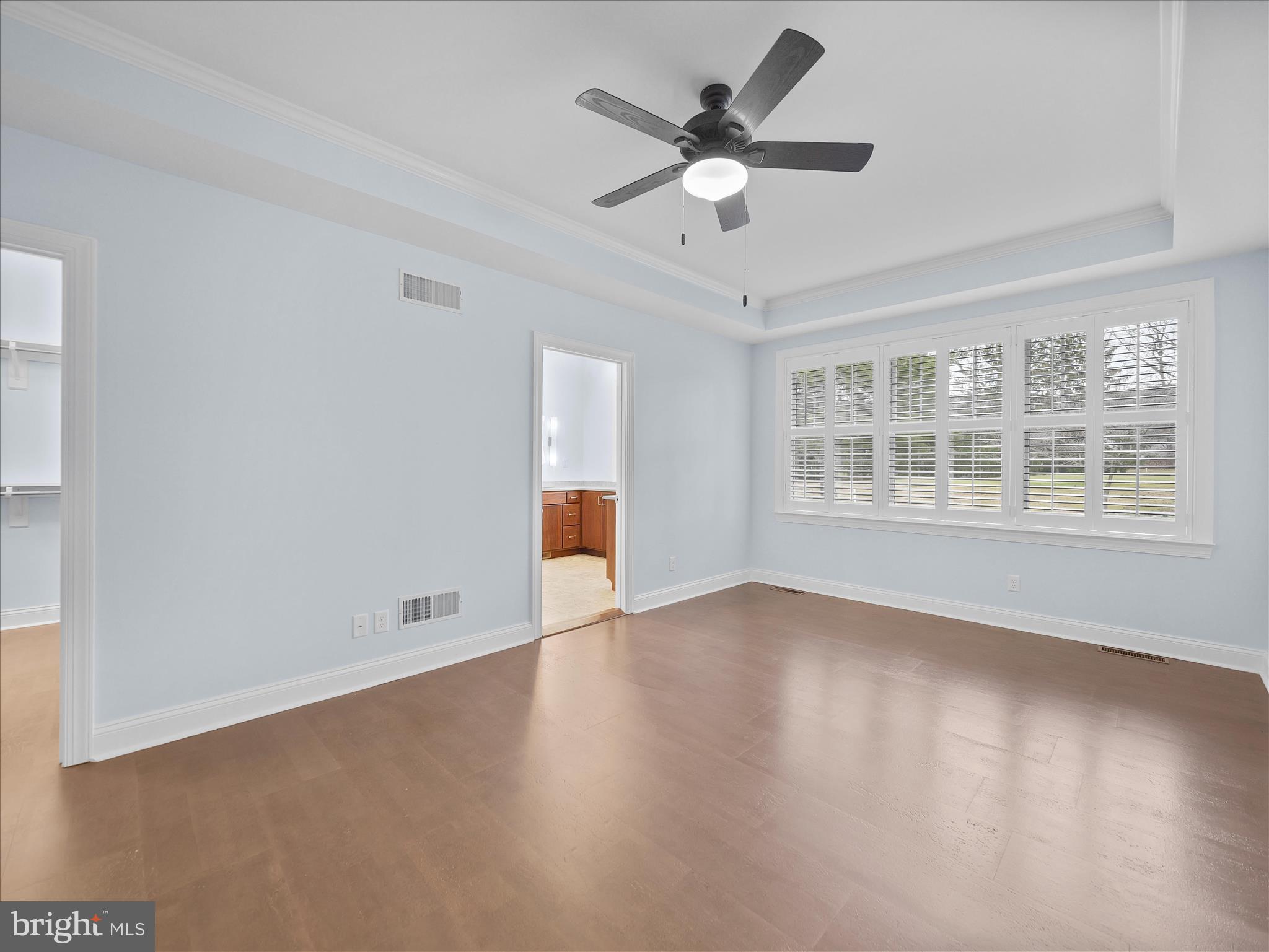 6881 Old Course Road Fayetteville, PA 17222 - Photo 19 of 40 an empty room with wooden floor and windows