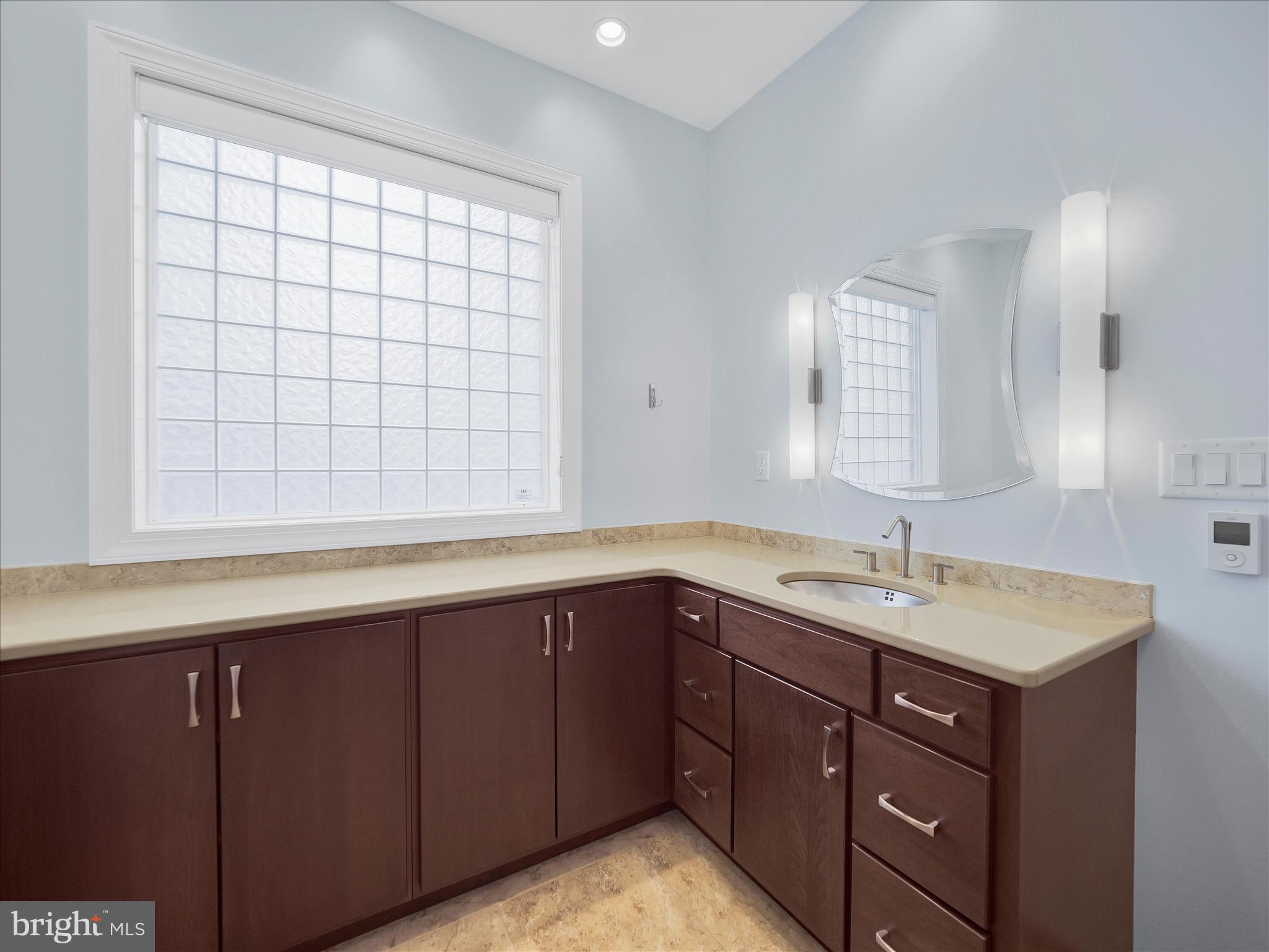 6881 Old Course Road Fayetteville, PA 17222 - Photo 22 of 40 a bathroom with a sink and a mirror