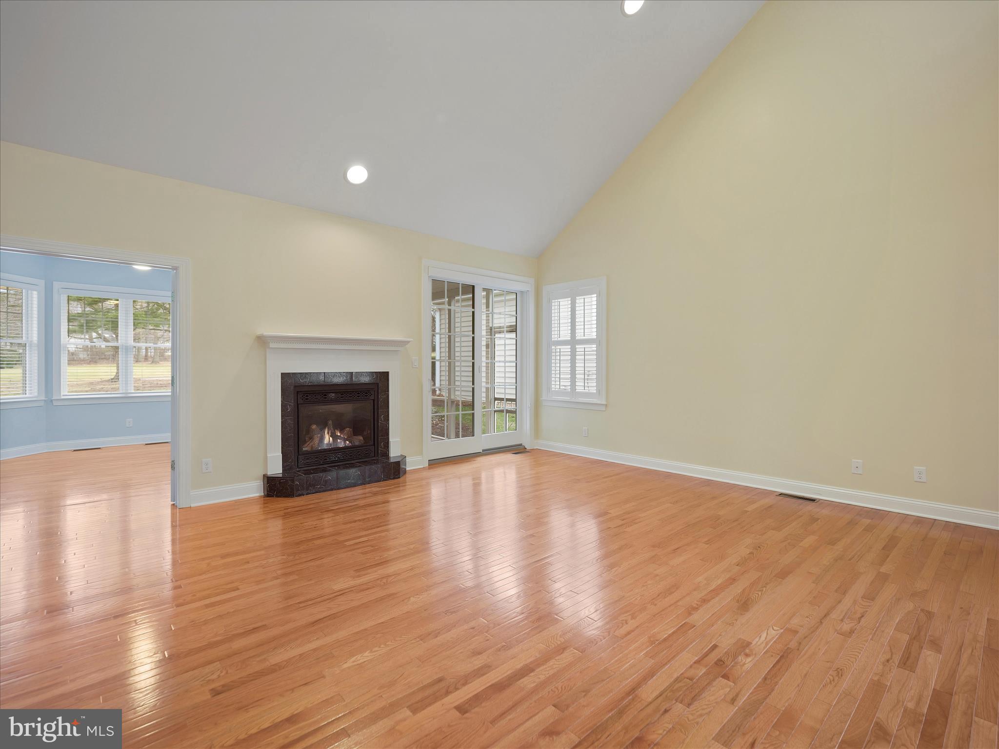 6881 Old Course Road Fayetteville, PA 17222 - Photo 3 of 40 a view of empty room with wooden floor and fireplace