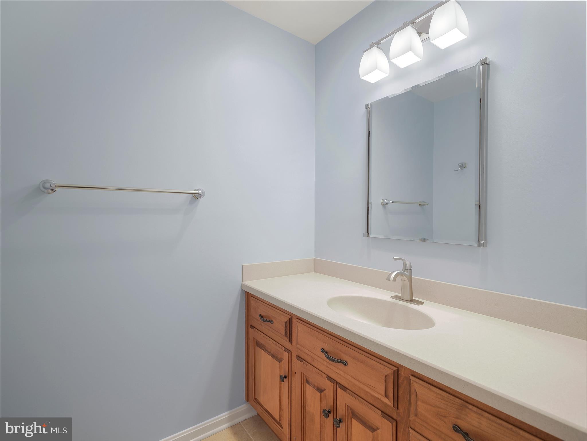 6881 Old Course Road Fayetteville, PA 17222 - Photo 31 of 40 a bathroom with a sink and a mirror