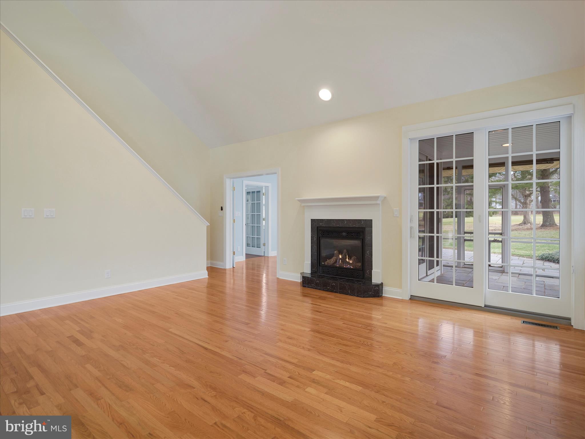 6881 Old Course Road Fayetteville, PA 17222 - Photo 4 of 40 a view of empty room with wooden floor and fireplace