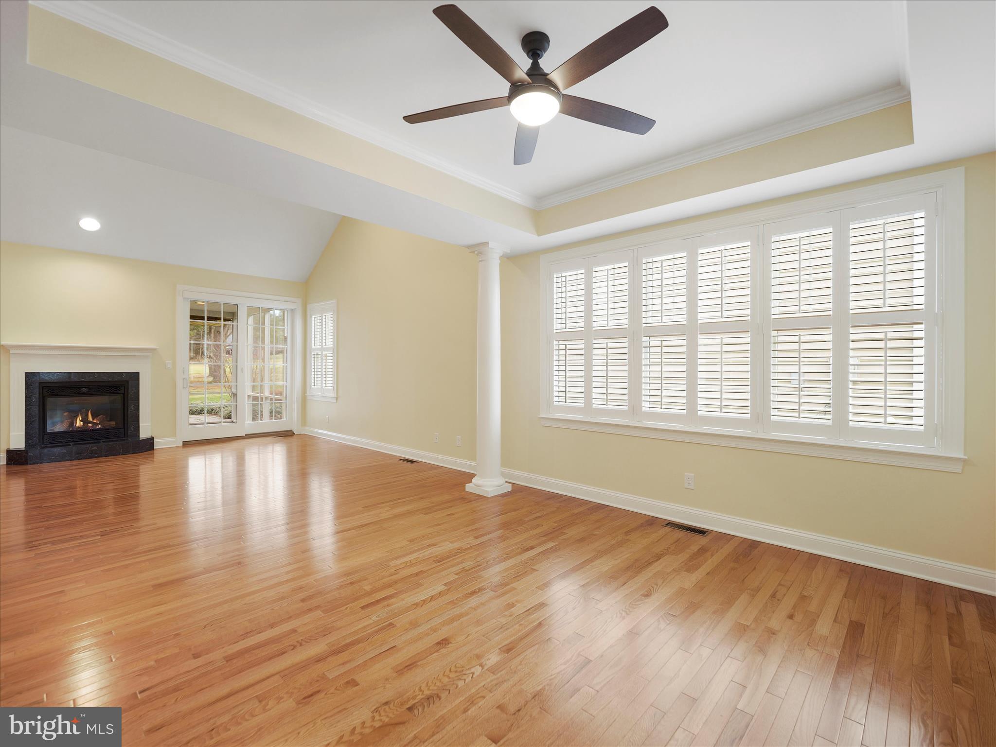 6881 Old Course Road Fayetteville, PA 17222 - Photo 7 of 40 a view of empty room with wooden floor and fan
