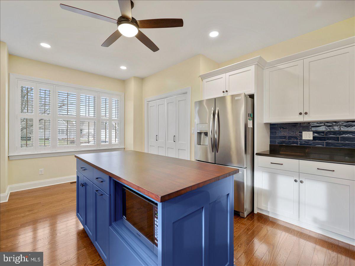 6881 Old Course Road Fayetteville, PA 17222 - Photo 9 of 40 a kitchen with stainless steel appliances granite countertop a refrigerator a sink and a stove
