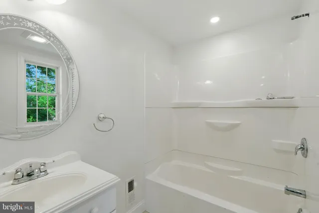 a bathroom with a sink and a bathtub