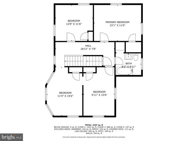 a picture of a bench in front of a wall