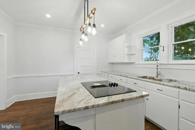 a kitchen with a sink cabinets and window