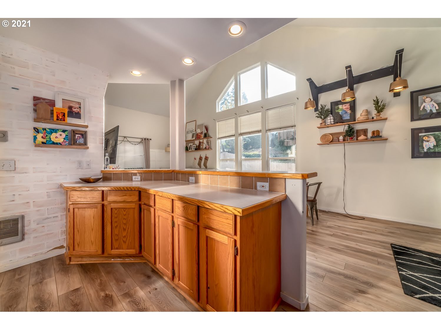 238 South 68th Court Springfield, OR 97478 - Photo 12 of 31 a kitchen with a sink cabinets and wooden floor