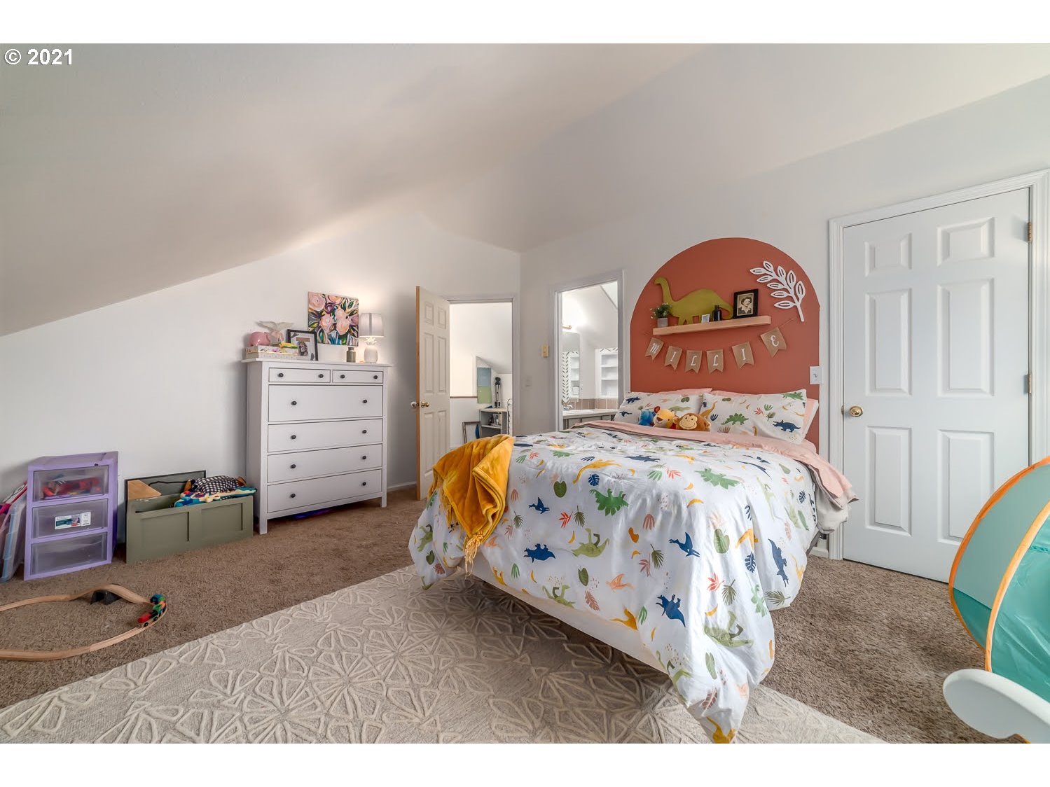 238 South 68th Court Springfield, OR 97478 - Photo 21 of 31 a bedroom with a bed a table and flowerpot