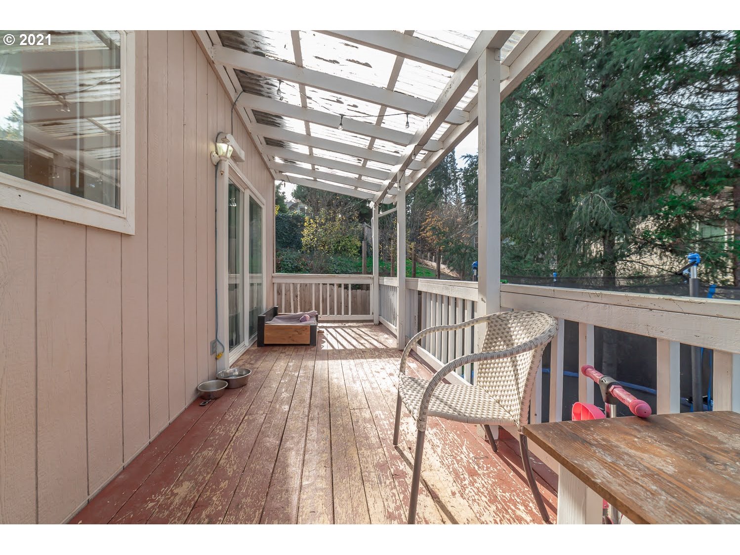 238 South 68th Court Springfield, OR 97478 - Photo 24 of 31 a view of a patio with a table chairs and a wooden fence