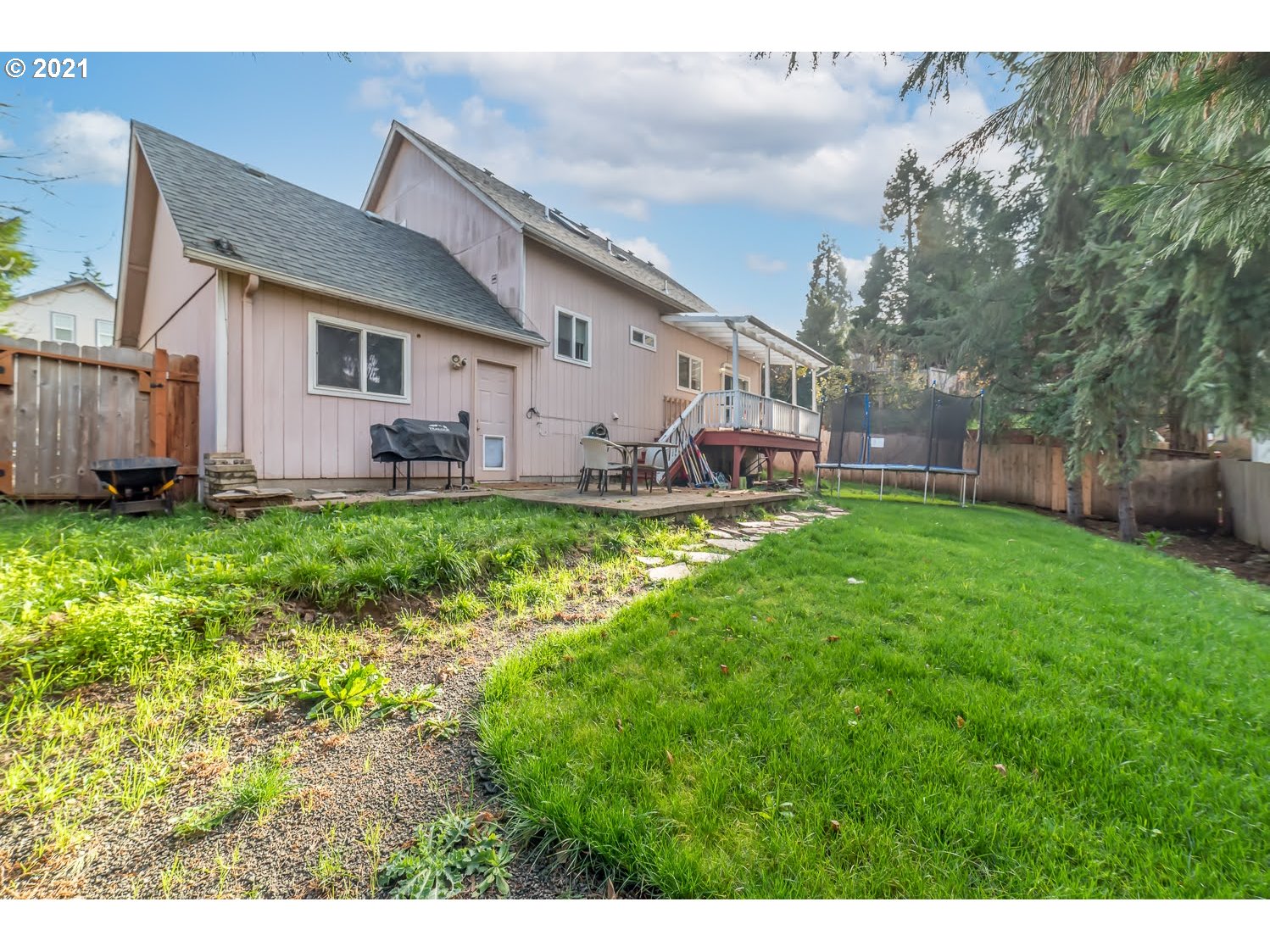 238 South 68th Court Springfield, OR 97478 - Photo 25 of 31 a backyard of a house with yard and outdoor seating