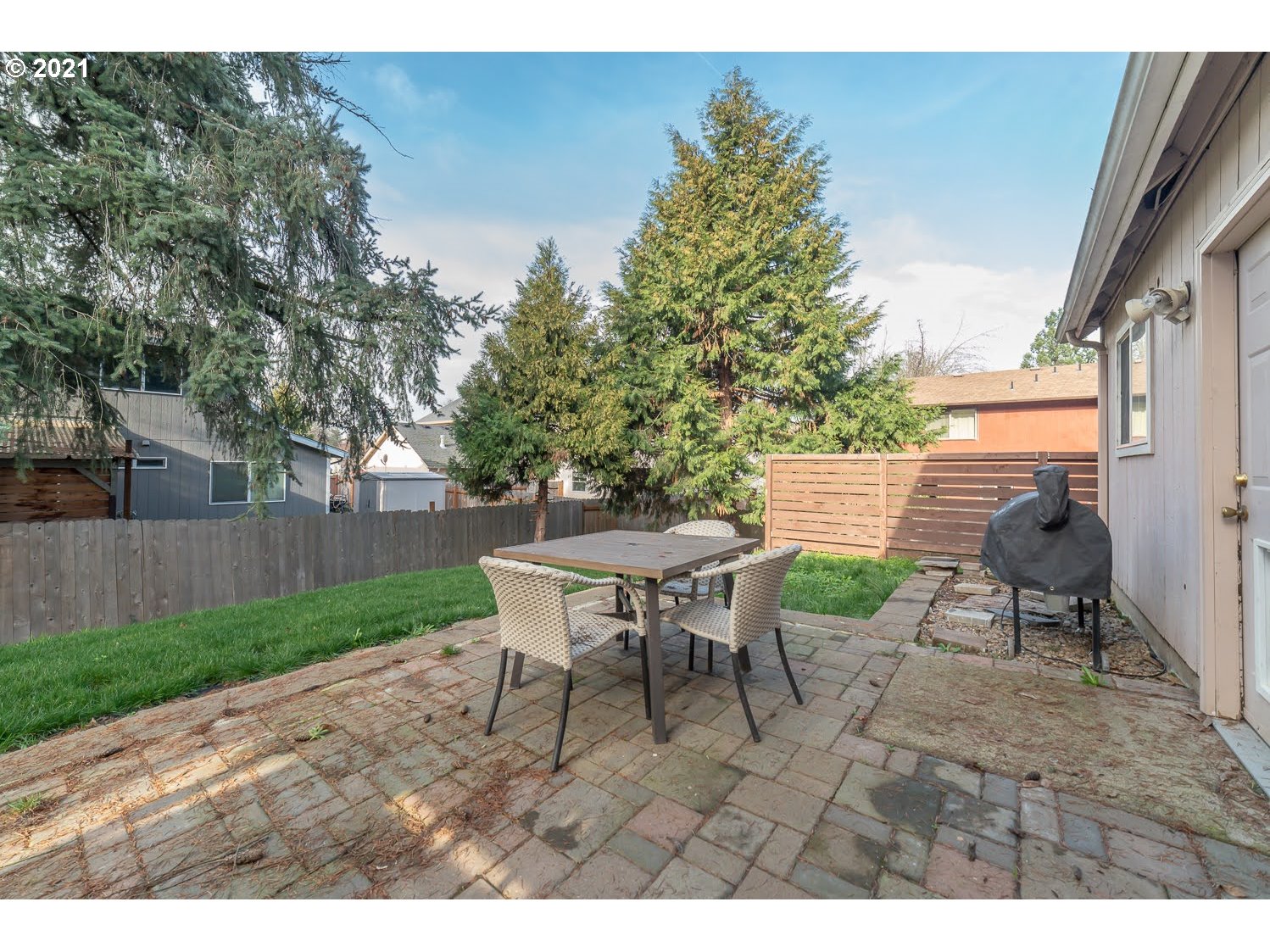238 South 68th Court Springfield, OR 97478 - Photo 27 of 31 a backyard of a house with table and chairs
