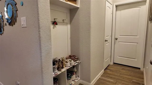 a view of a storage & utility room with dryer and washer