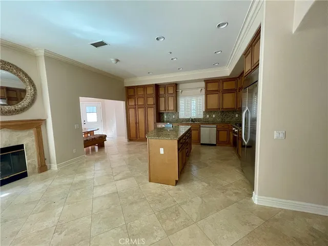 a kitchen with a sink and a stove top oven