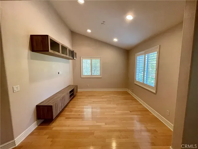 a lamp on a table in a room with a chandelier