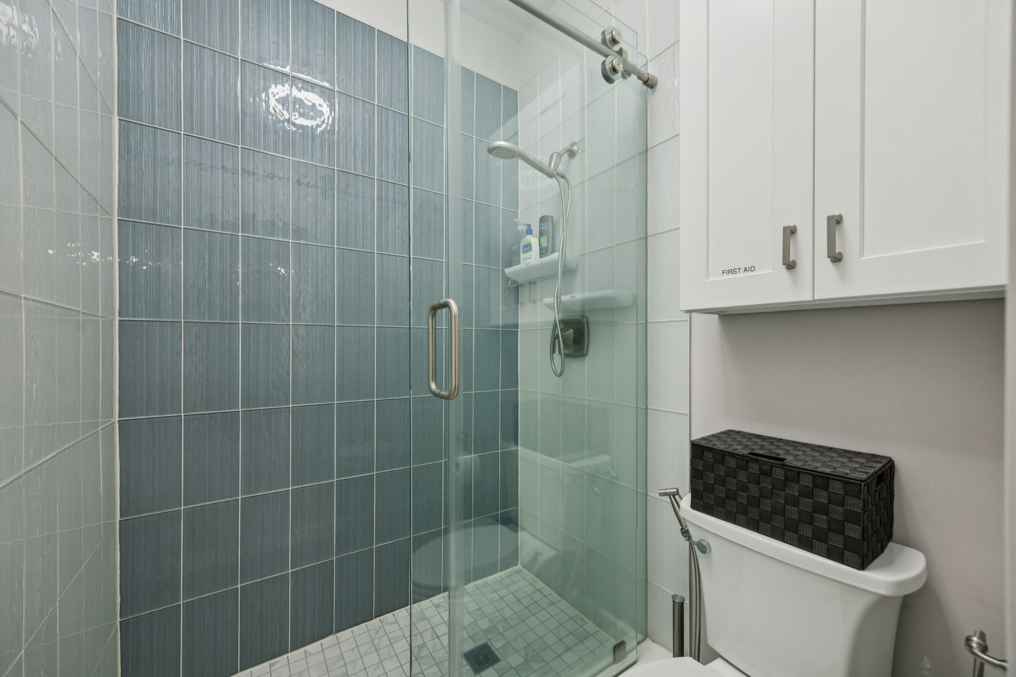 500 River Road, Unit 106 Montgomery, TX 77356 - Photo 22 of 32 This stunning secondary shower boasts glass and marble tile work, a heavy duty sliding glass door, and additional hanging storage.