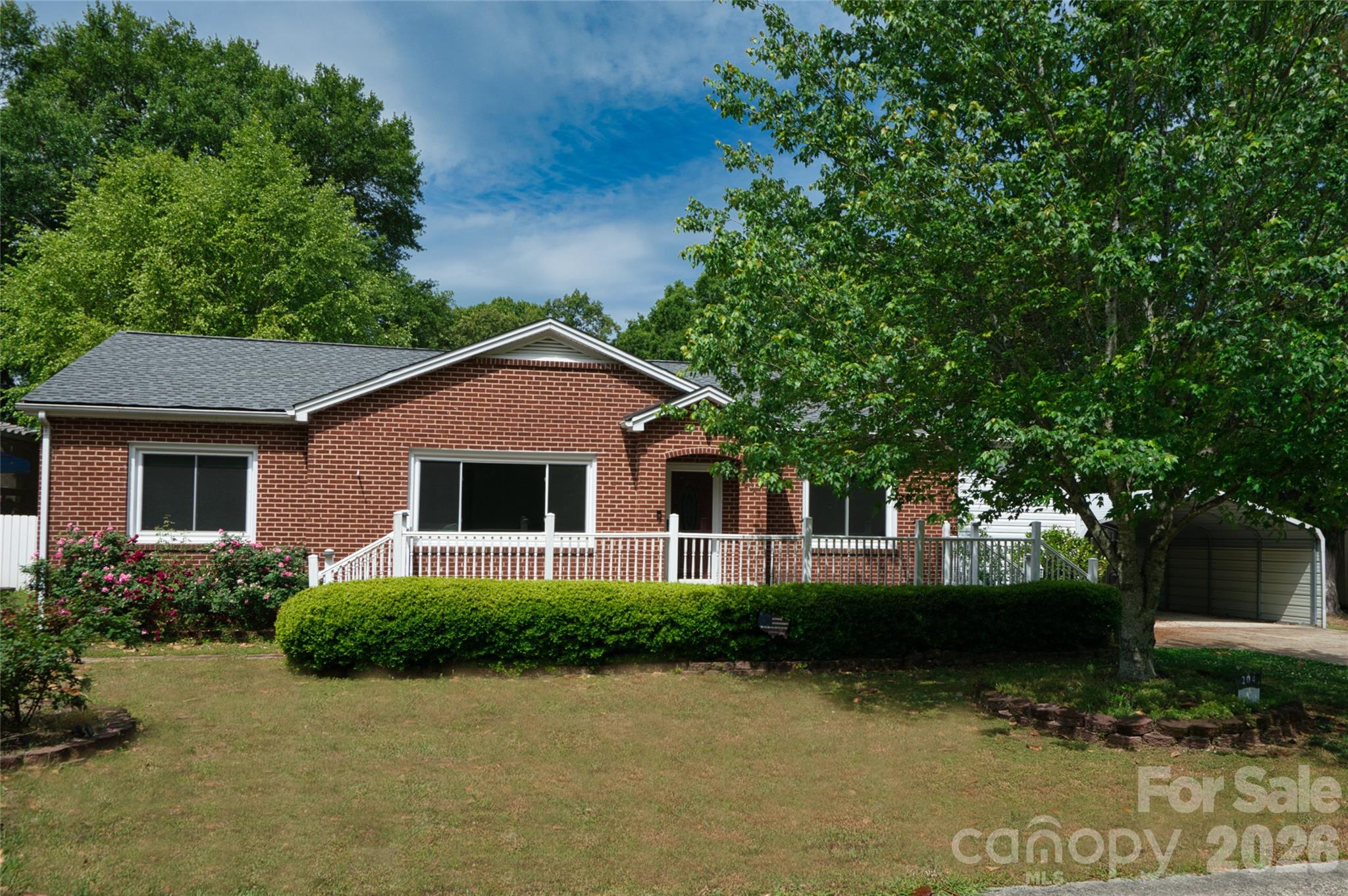 204 Clinton Avenue Clover, SC 29710 - Photo 1 of 26 a front view of a house with a yard