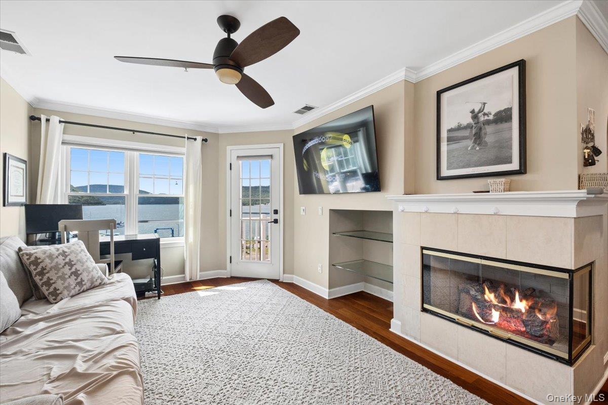 225 Waterside Close Peekskill, NY 10566 - Photo 7 of 40 Hardwood-style flooring , crown molding and gas fireplace
