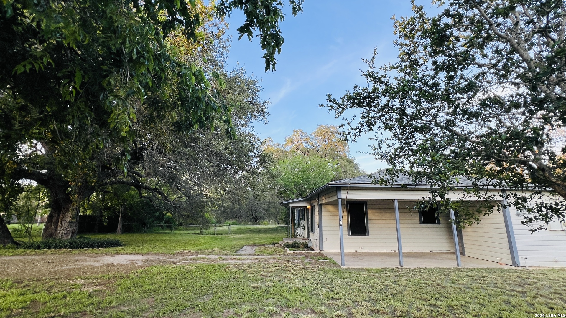 149 South Carroll Street Poth, TX 78147 - Photo 28 of 28 a white house that has a tree in front of it