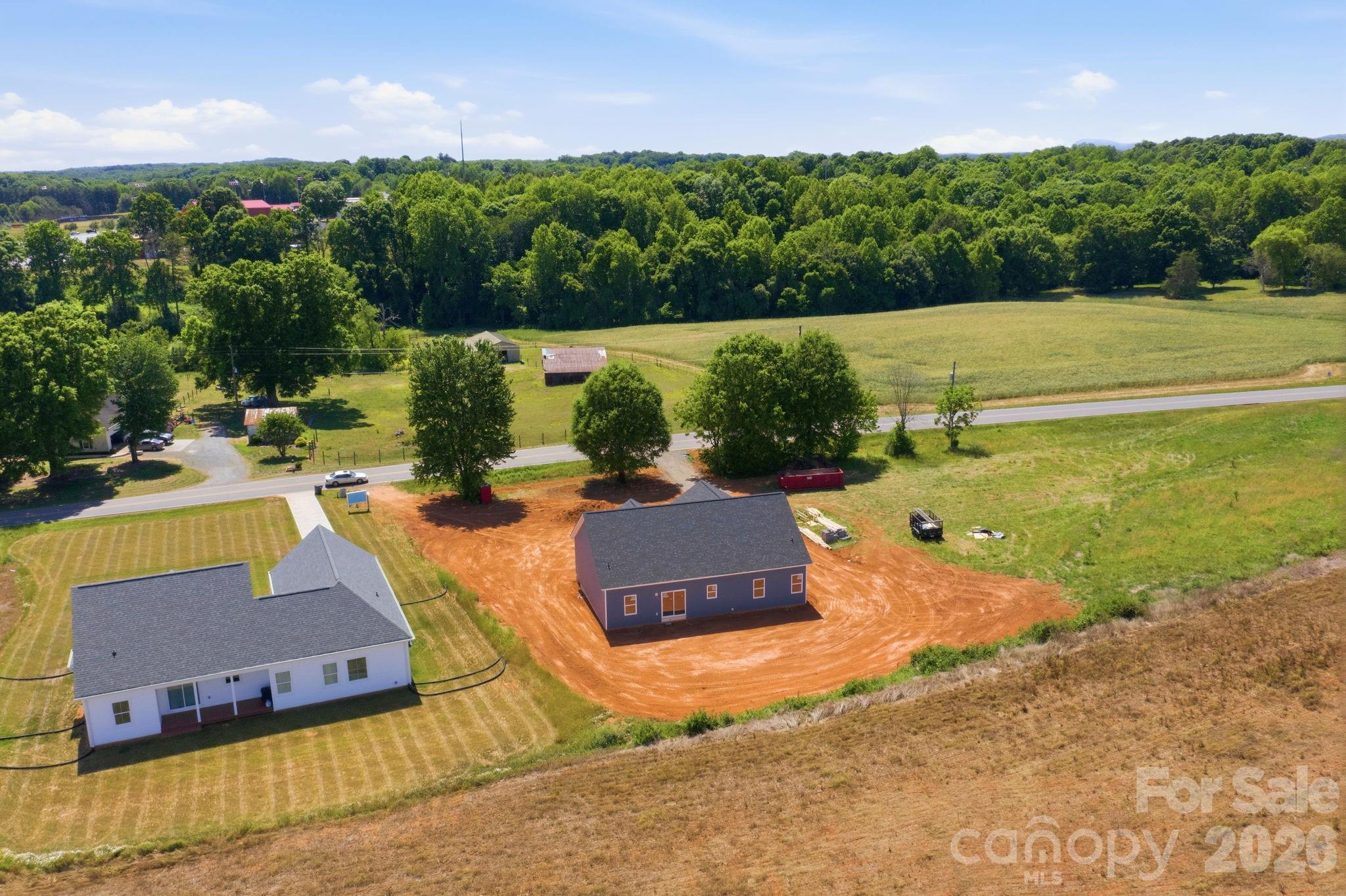 1720 Jennings Road Olin, NC 28660 - Photo 9 of 15 a view of a swimming pool and lake view