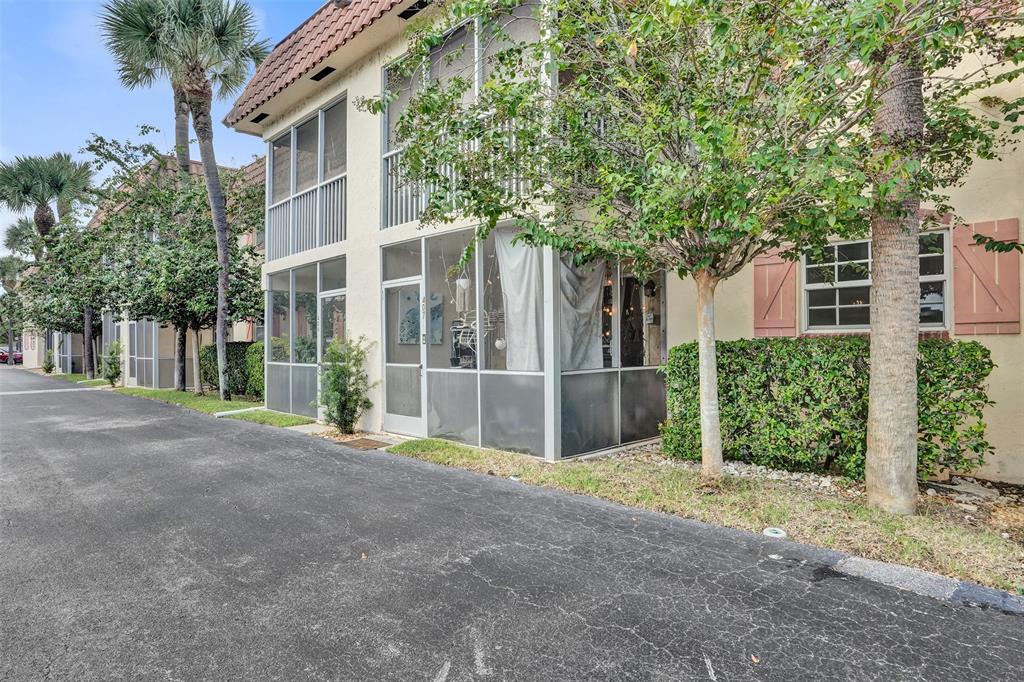 101 East McNab Road, Unit 407 Pompano Beach, FL 33060 - Photo 22 of 29 a view of backyard of house with green space