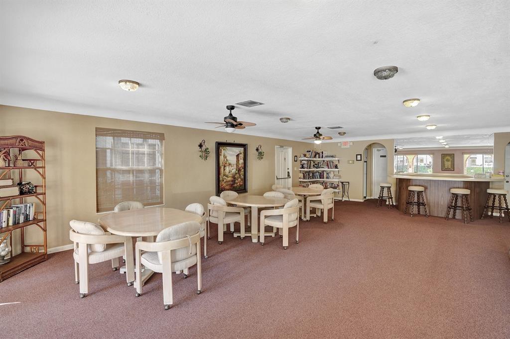 101 East McNab Road, Unit 407 Pompano Beach, FL 33060 - Photo 23 of 29 a view of a livingroom with furniture and window