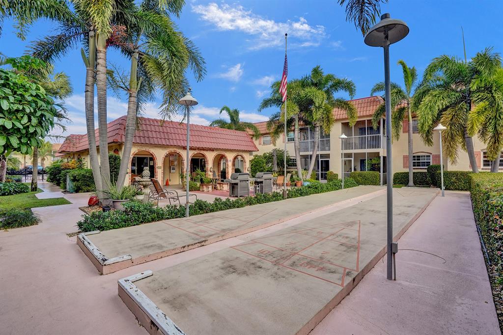 101 East McNab Road, Unit 407 Pompano Beach, FL 33060 - Photo 25 of 29 a view of a street with palm trees