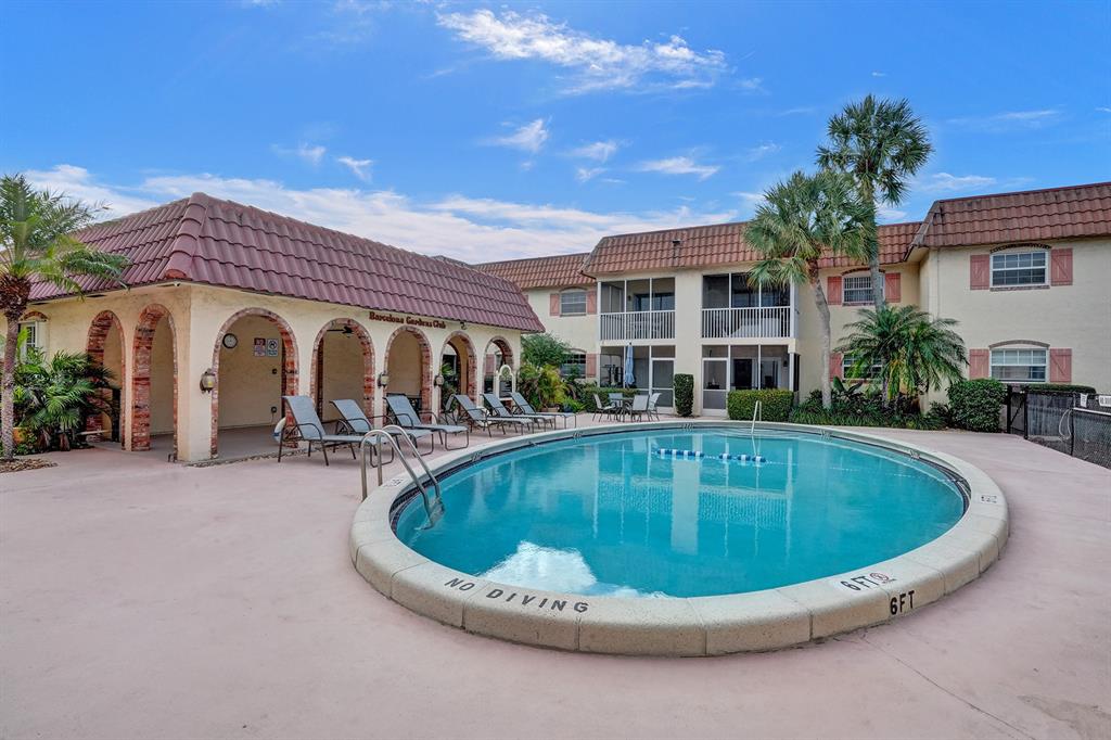 101 East McNab Road, Unit 407 Pompano Beach, FL 33060 - Photo 28 of 29 a view of outdoor space yard swimming pool and porch