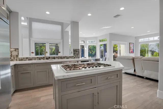 a living room with furniture a rug and a flat screen tv