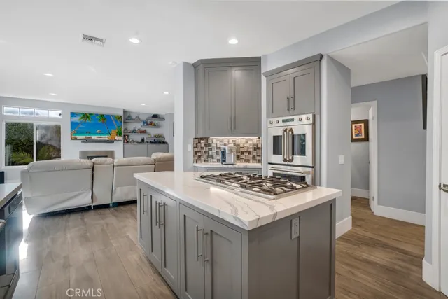 a living room with furniture fireplace and flat screen tv