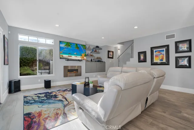 a view of a livingroom with furniture and wooden floor