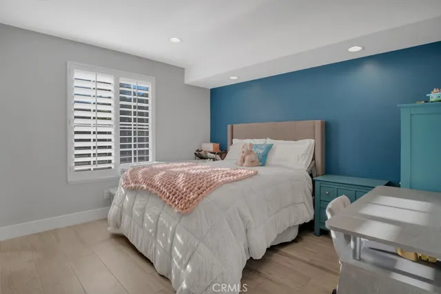 a view of a patio with table and chairs potted plants and large tree