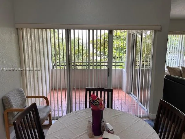 a view of a chair and table in the balcony