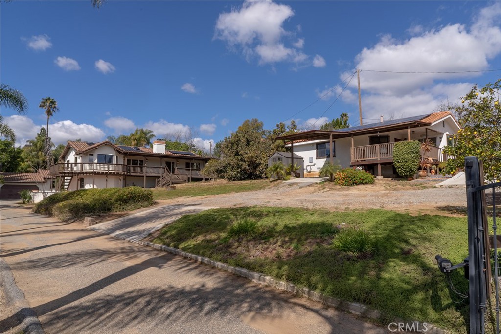 a view of house with yard