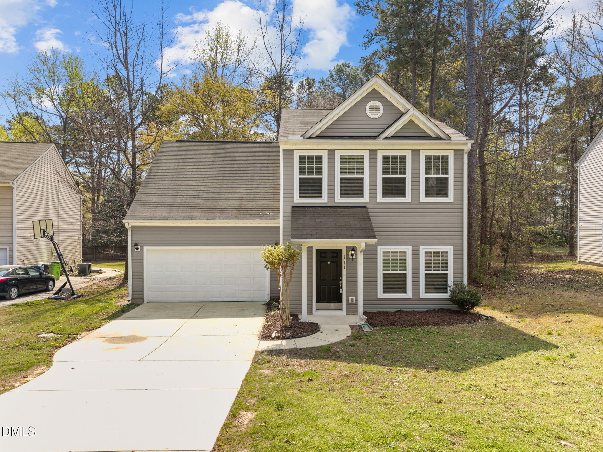 1071 Heritage Manor Drive Raleigh, NC 27610 - Photo 1 of 42 a front view of a house with garden