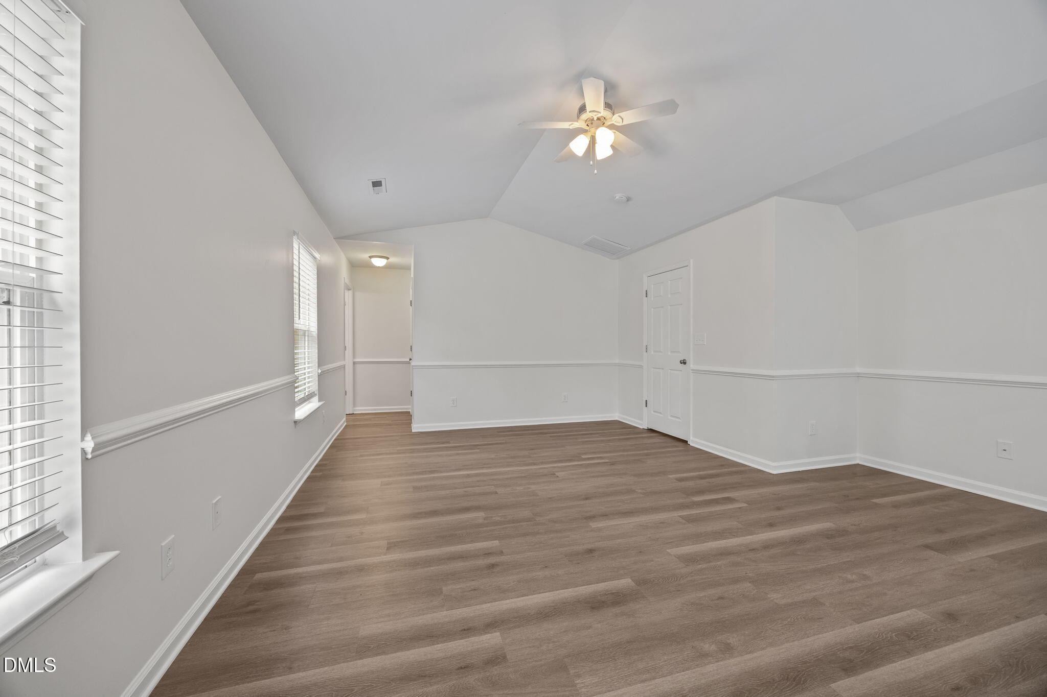1071 Heritage Manor Drive Raleigh, NC 27610 - Photo 17 of 42 a view of an empty room with wooden floor