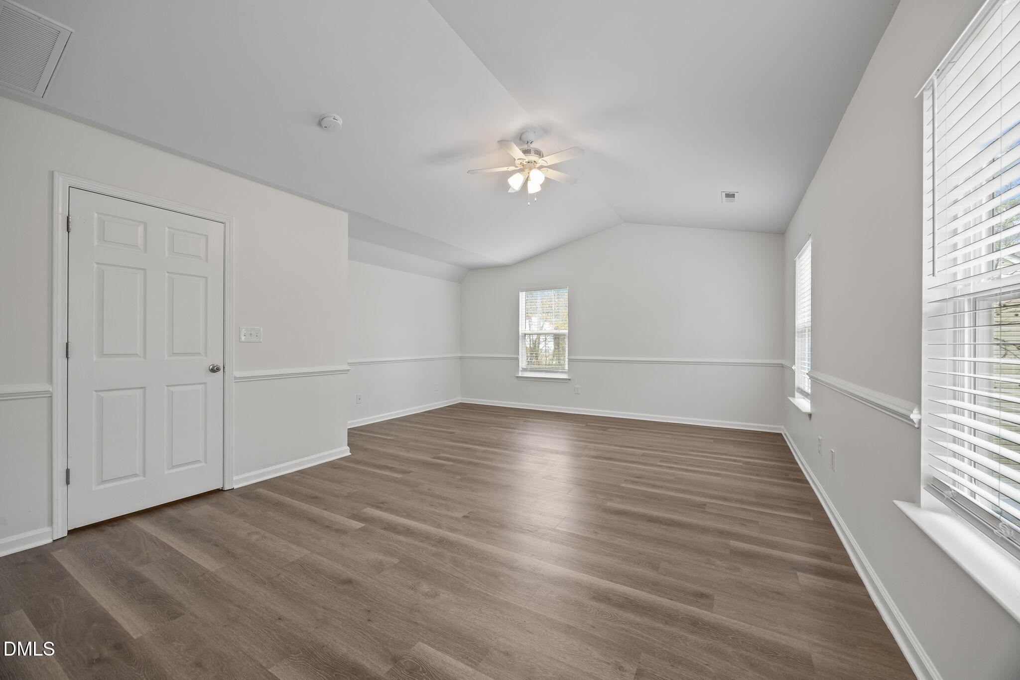 1071 Heritage Manor Drive Raleigh, NC 27610 - Photo 18 of 42 wooden floor in an empty room with a window