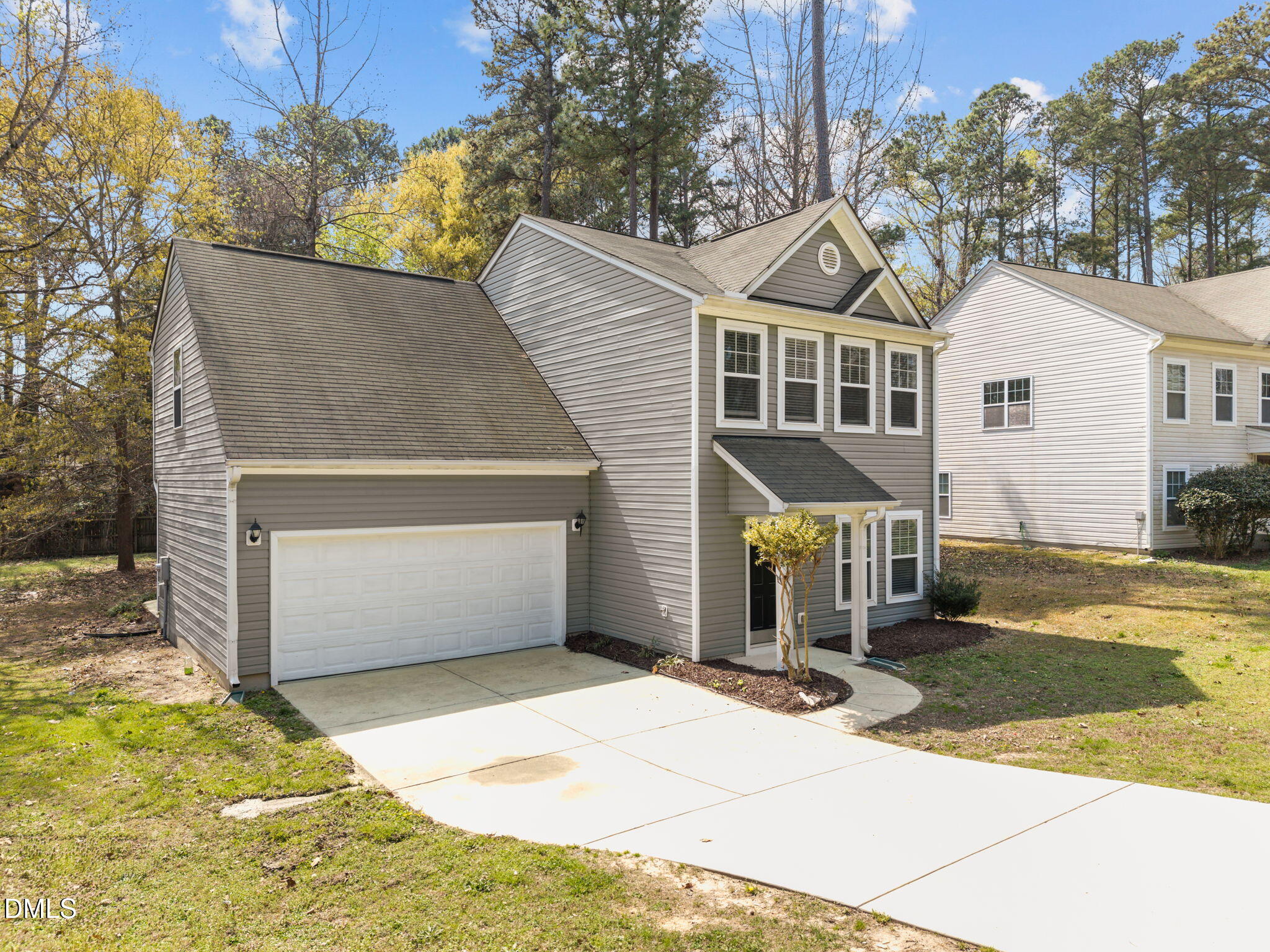1071 Heritage Manor Drive Raleigh, NC 27610 - Photo 2 of 42 a front view of a house with yard and garage