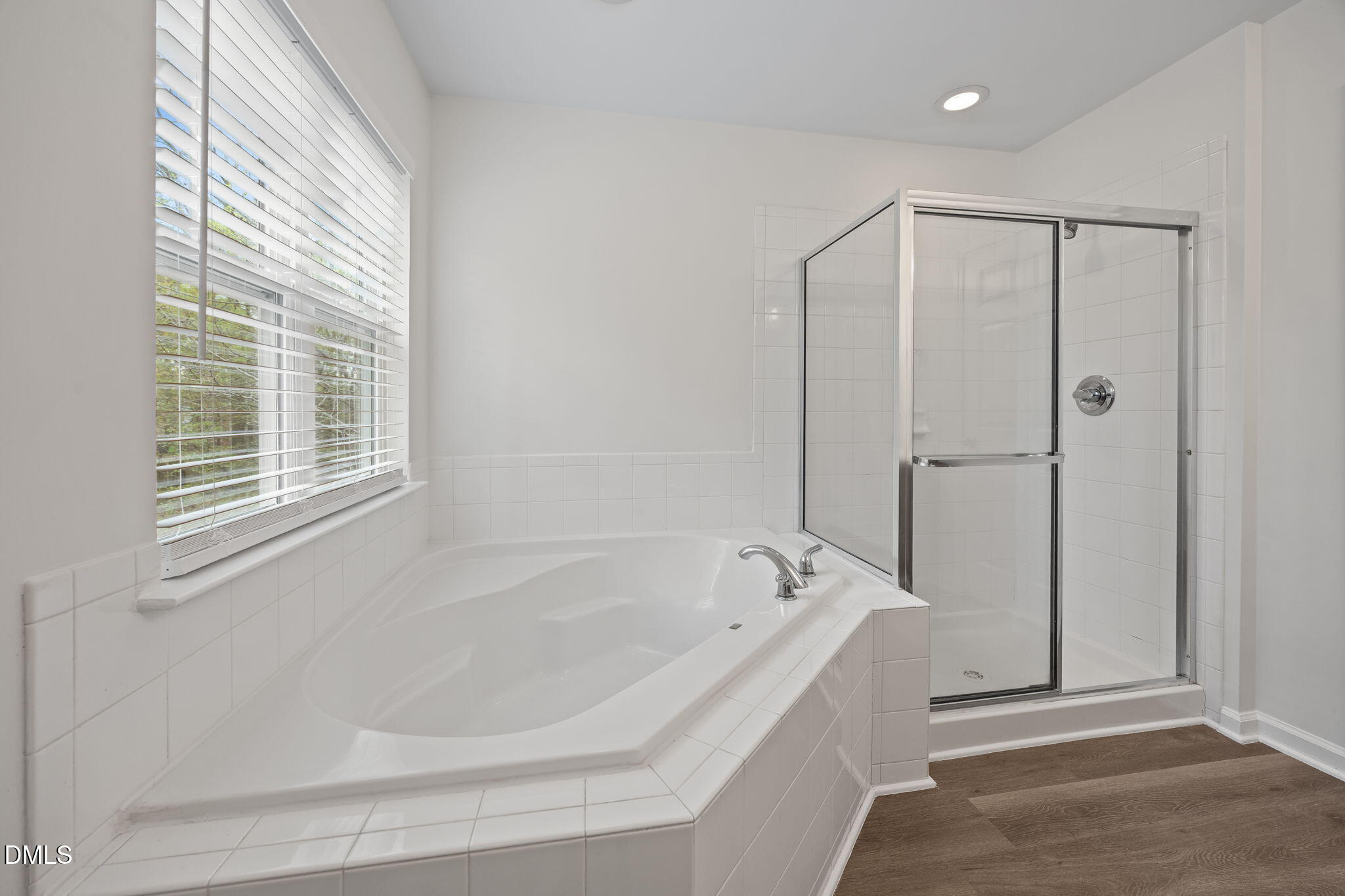 1071 Heritage Manor Drive Raleigh, NC 27610 - Photo 21 of 42 a white bath tub sitting next to a shower