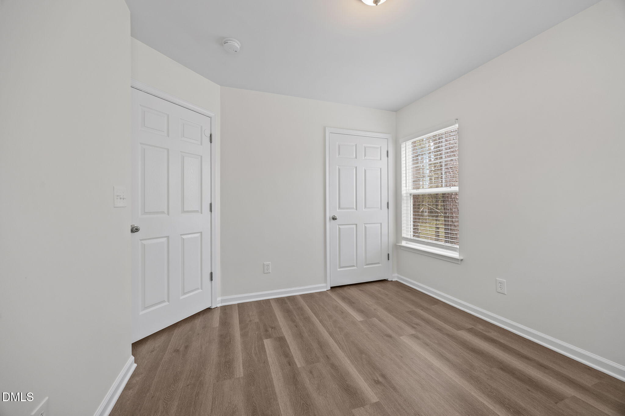 1071 Heritage Manor Drive Raleigh, NC 27610 - Photo 29 of 42 a view of empty room with wooden floor and fan