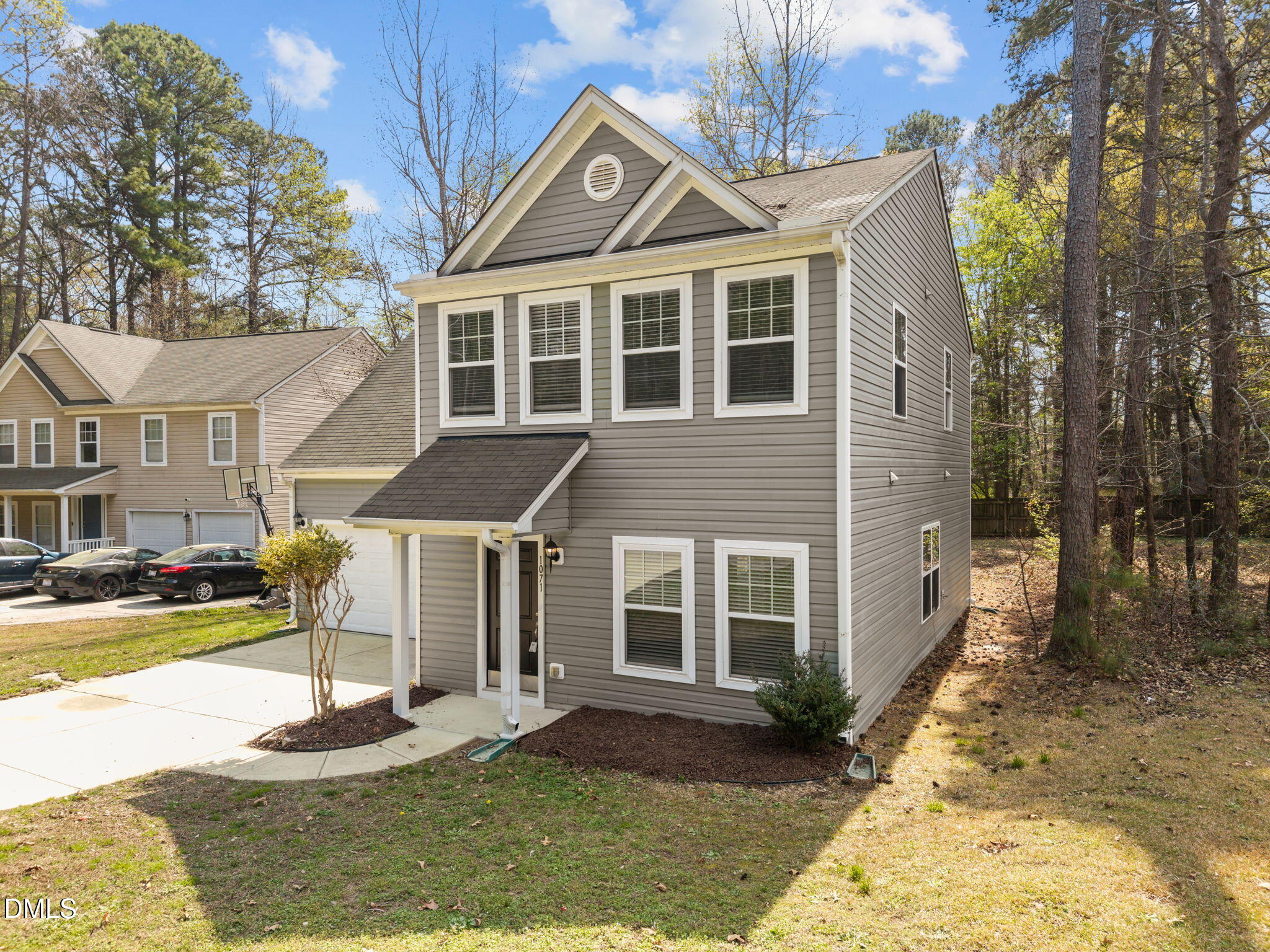 1071 Heritage Manor Drive Raleigh, NC 27610 - Photo 3 of 42 a front view of a house with a yard